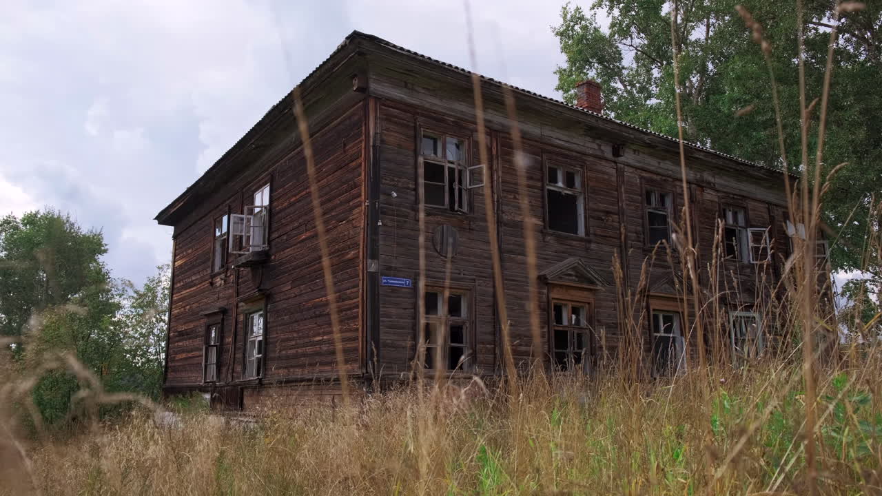 Abandoned Wooden House in a Field