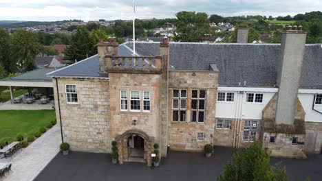 cinematic flight from left to right over dalmeny park, a luxurious scottish country mansion