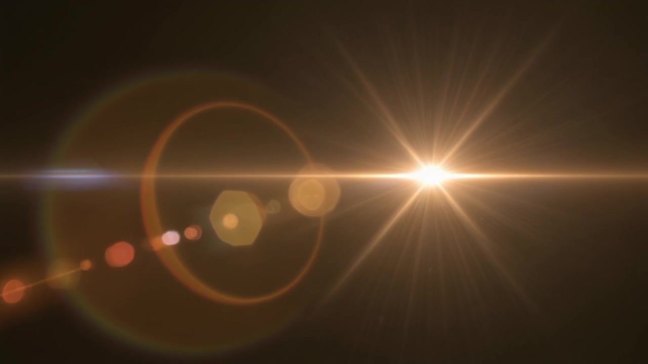 Luminoso effetto flare dorato su sfondo scuro