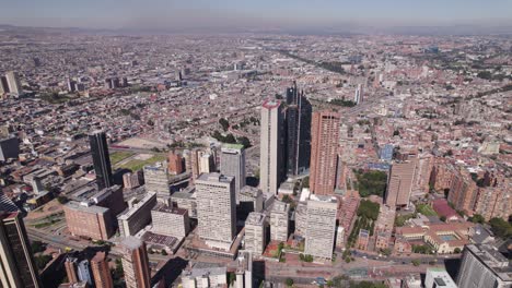 Aerial-orbit-downtown-Bogota,-Colombia,-huge-skyscrapers-and-cityscape-view