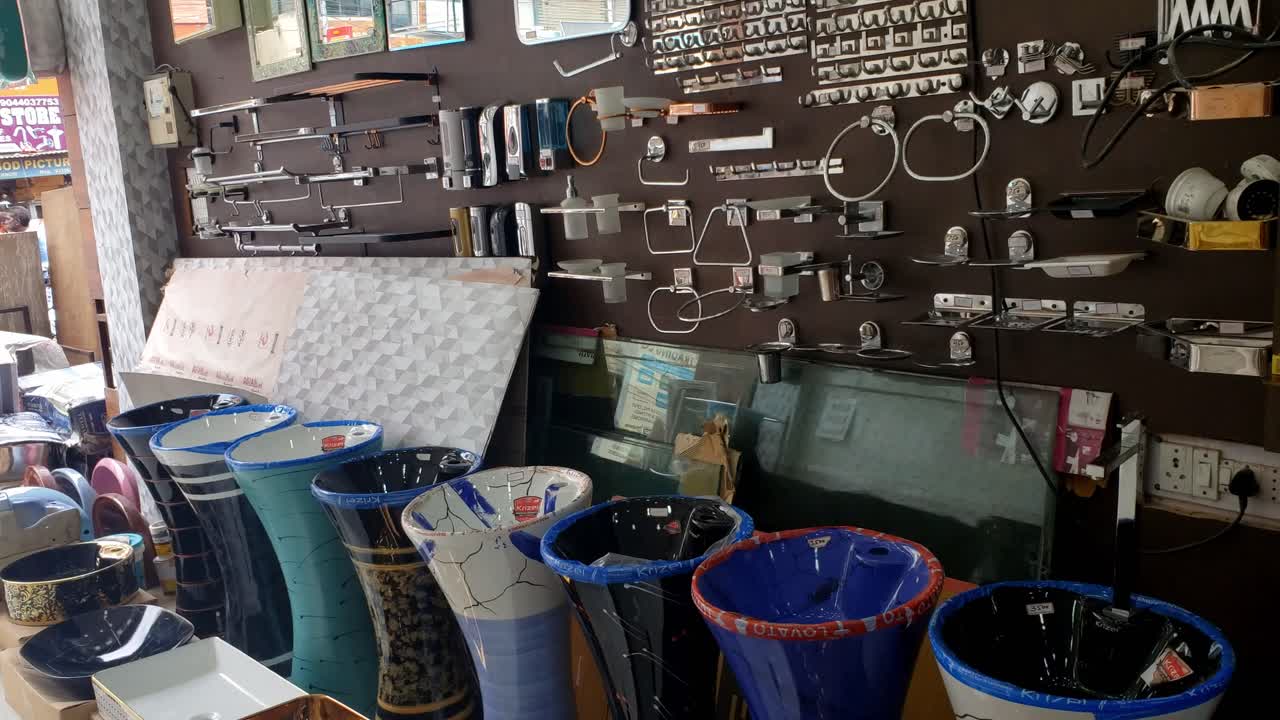 Water taps of different types and shapes on the counter in the store. Retail trade in sanitary ware. Foreground. Selective focus