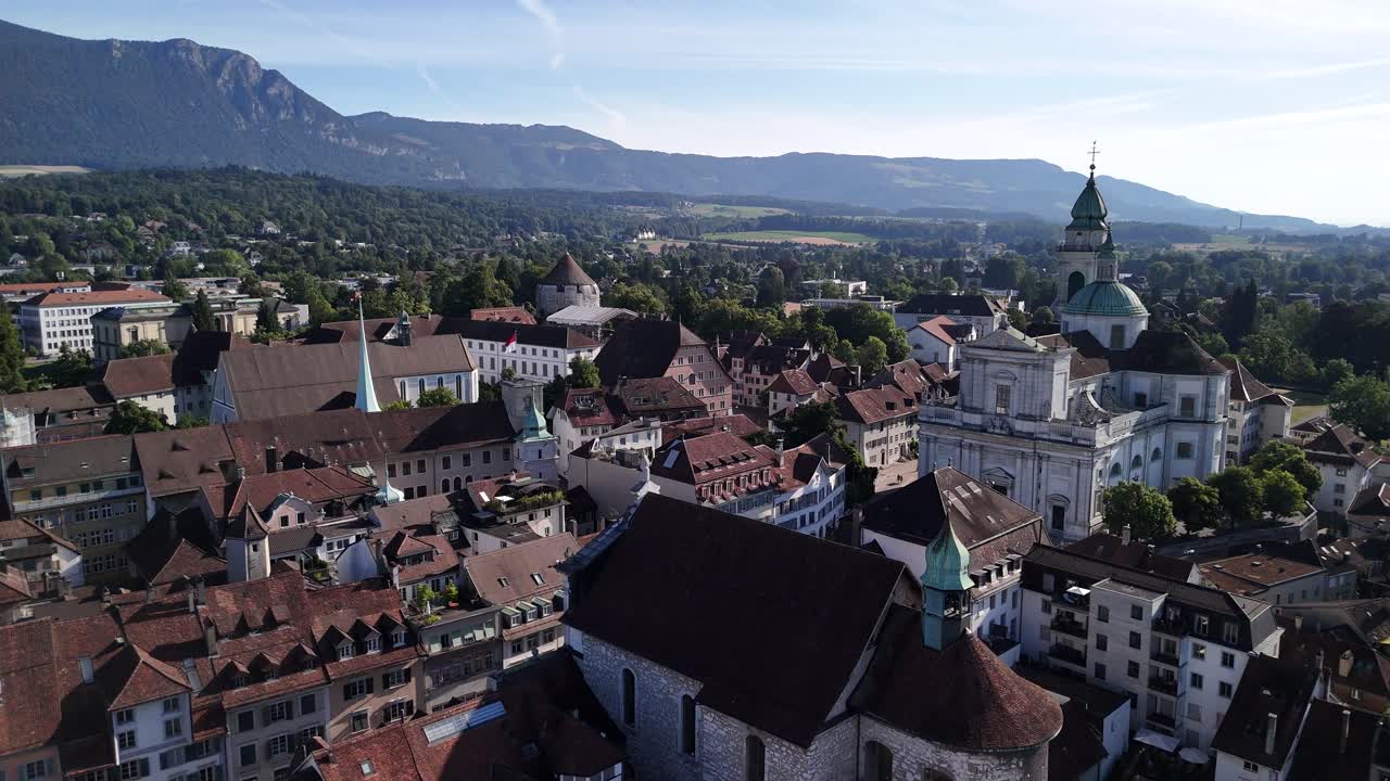 Aerial view of cityscape with mountains