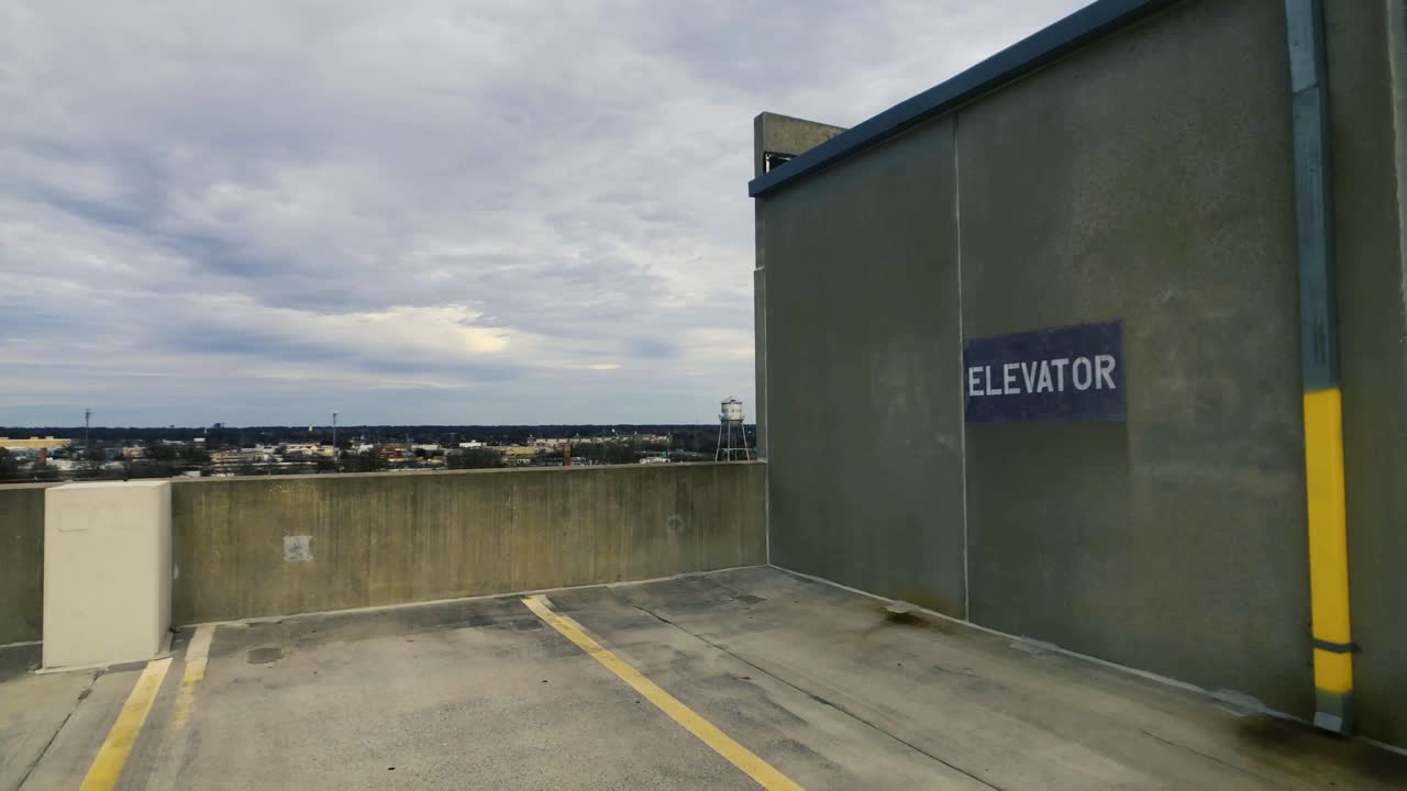 Parking Garage Elevator Exterior and Downtown Skyline View