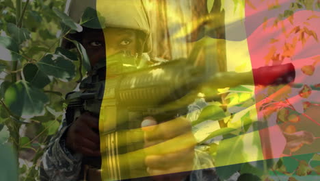 animation of flag of belgium over african american male soldier with rifle