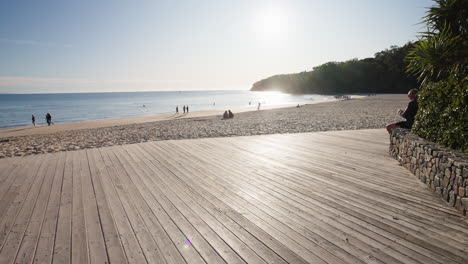 Boardwalk-Entrance-To-Sandy-Beach-In-Noosa-Heads-Tourist-Destination,-4K-Slow-Motion