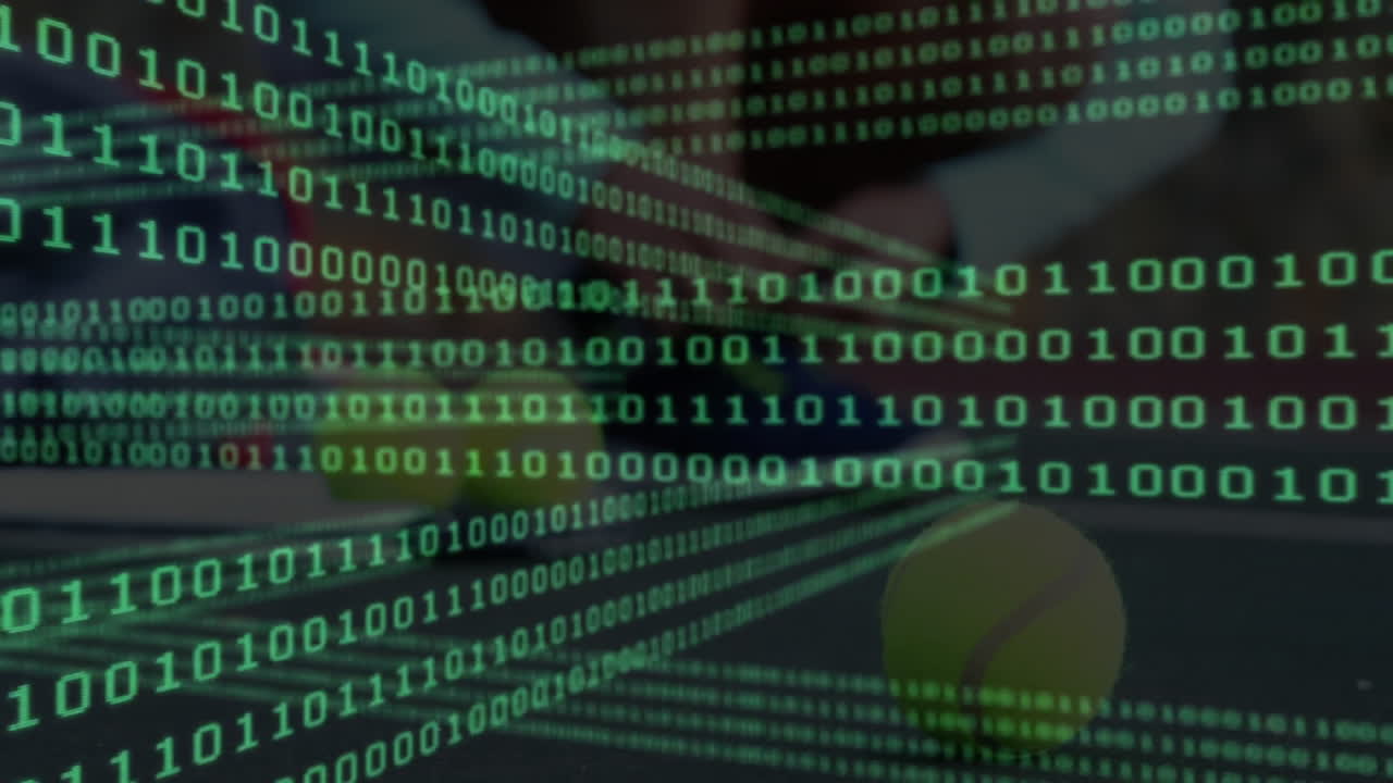 tech designer working at office desk, analyzing floating green binary code over yellow green ball