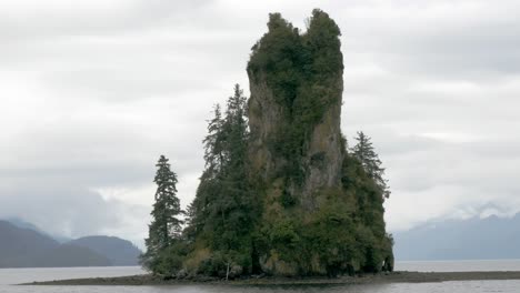 A-close-shot-of-New-Eddystone-Rock,-a-massive-rock-formation-that-sits-on-an-isle-in-Alaska