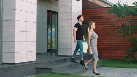 Sexy-couple-going-outside-with-bags.-Happy-family-enjoying-shopping-together.