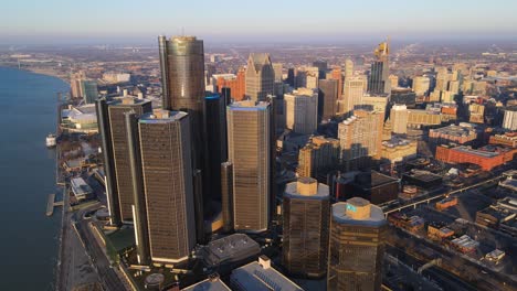 detroit skyline with renaissance center with golden sunlight in aerial view