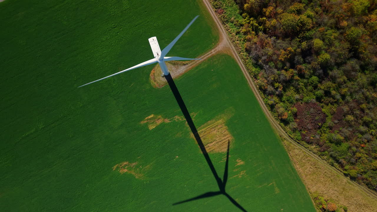 Aerial View of Wind Turbine in Green Field