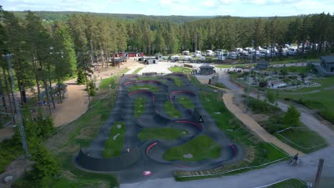 Drone-shot-flying-over-Isaberg-bike-park-in-mountains-of-Sweden