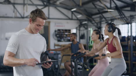 coach using a digital tablet in a gym