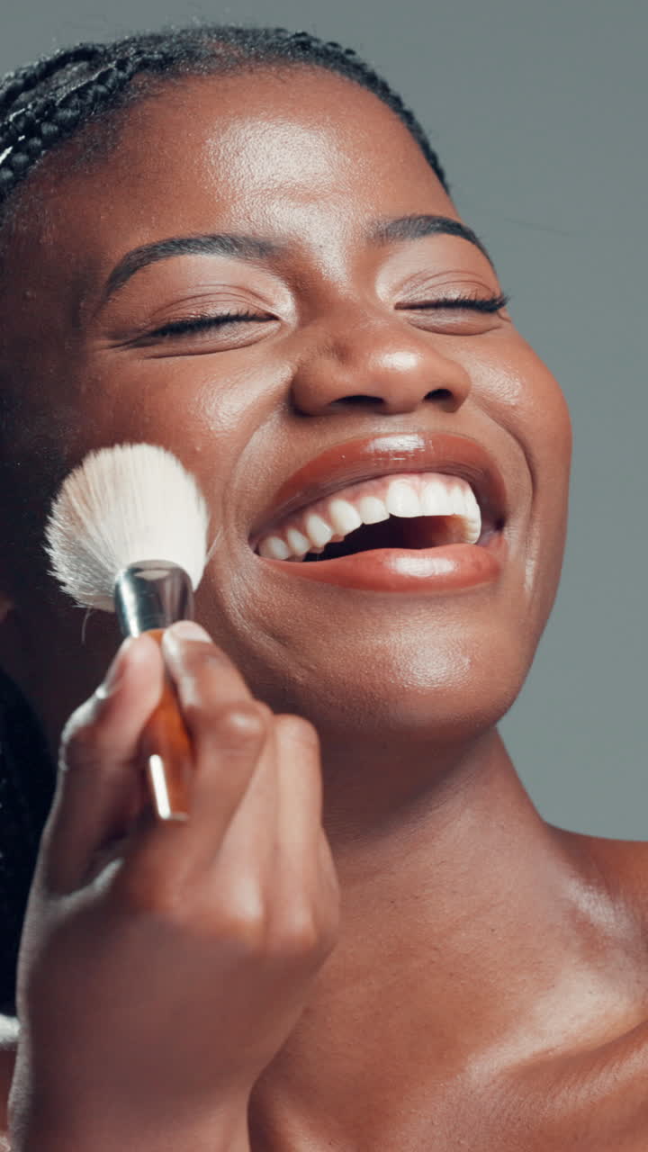Happy Young Black Woman Smiling While Applying Makeup