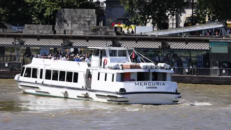 boat cruising on river thames in london