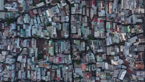 Top-down-of-high-density-urban-rooftops-in-district-four-port-area-along-the-Saigon-river-in-Ho-Chi-Minh-City,-Vietnam