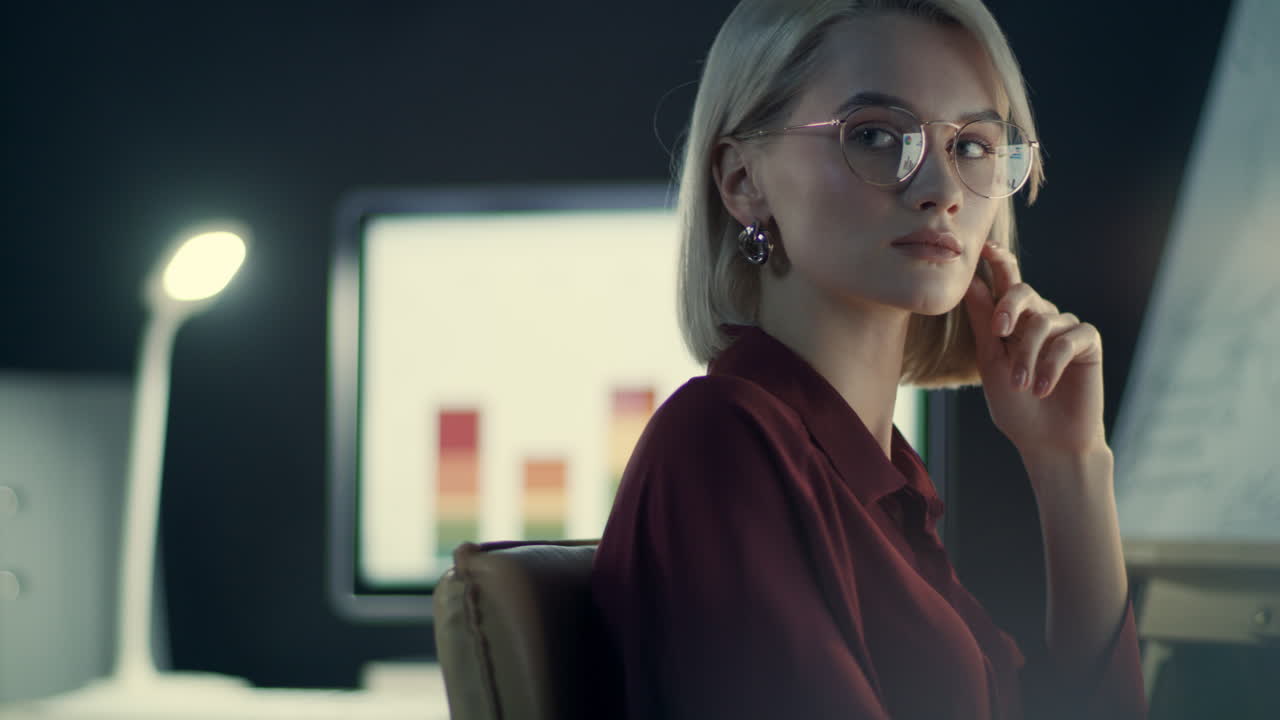 Overworked business woman working on computer in night office