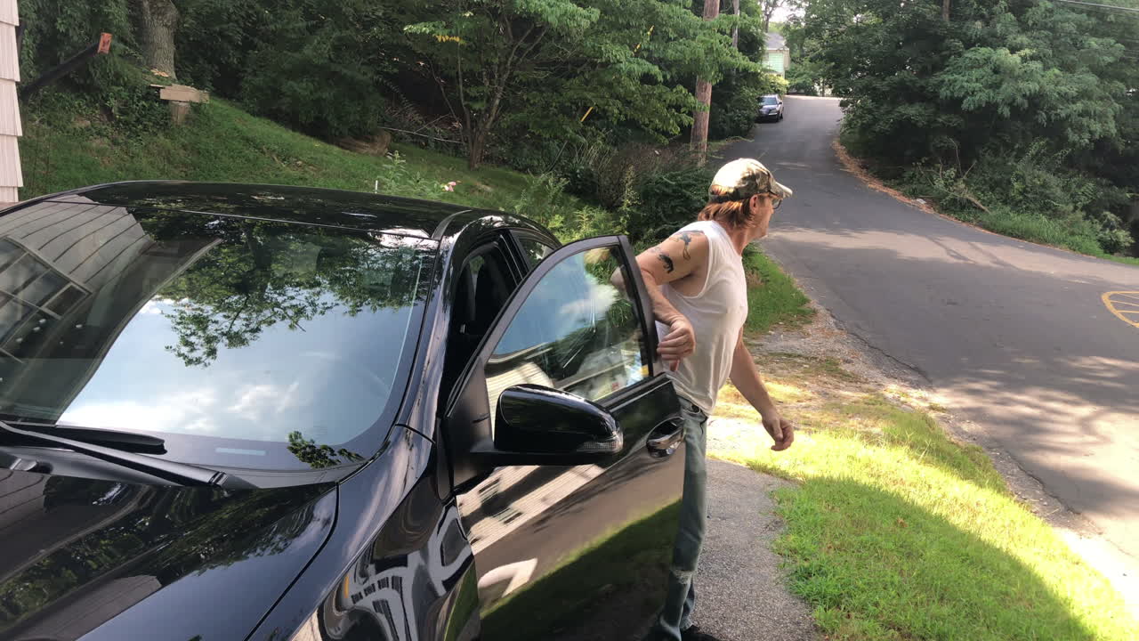 Man getting out of a car
