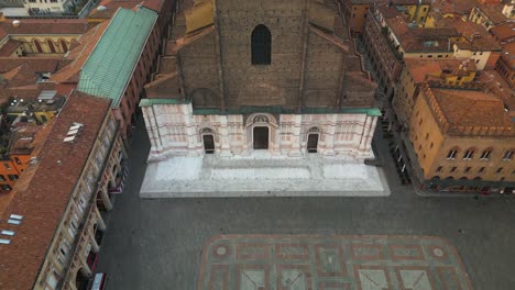 pan up reveals basilica san petronio, piazza maggiore - bologna, italy