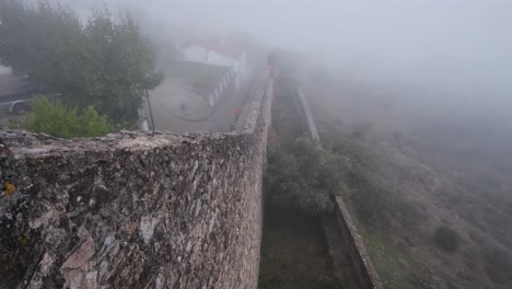 mist covered wall around marvão village and castle