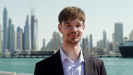 man in elegant suit posing outdoors