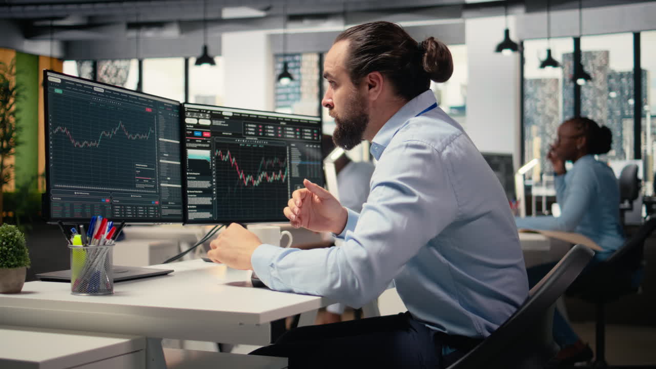 Sad portfolio manager in office dejected by negative investment returns