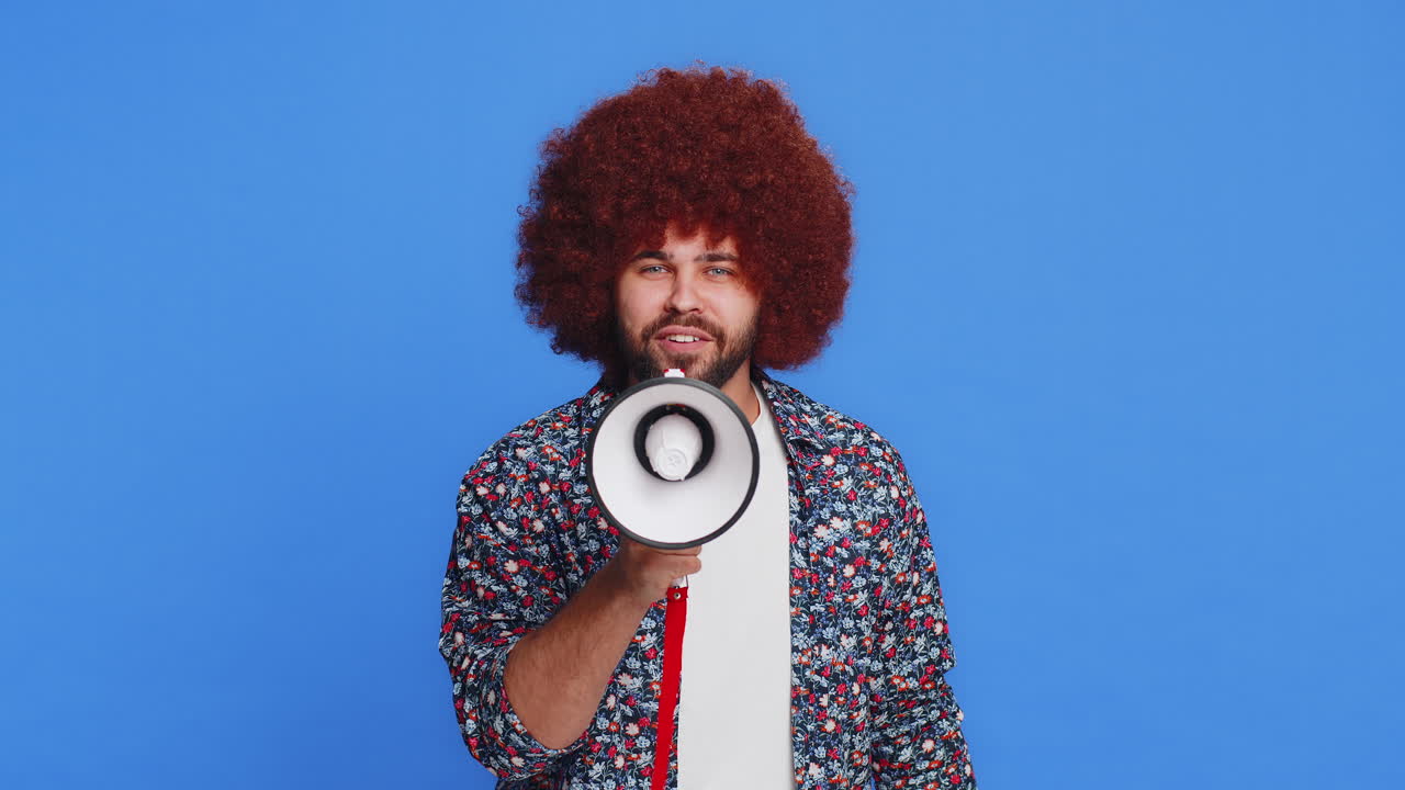 Caucasian man talking with megaphone proclaiming news loudly announcing advertisement discounts sale
