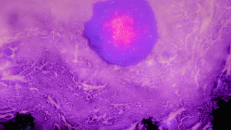 organic purple abstract art fluid effect with neon particles expanding