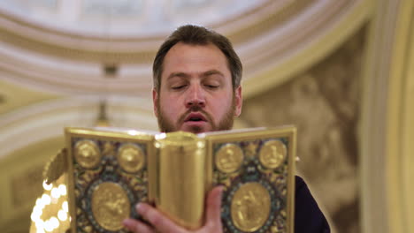 Priest-holding-holy-book