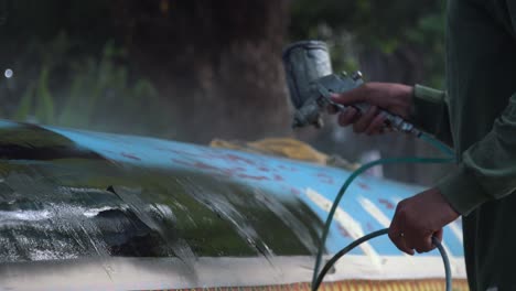 Close-Shot-of-Boat-Spraying-Paint