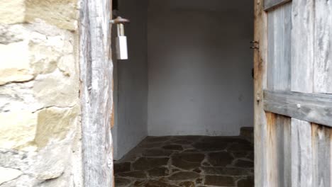 first person view coming backing out of old mission house showing fireplace and interior