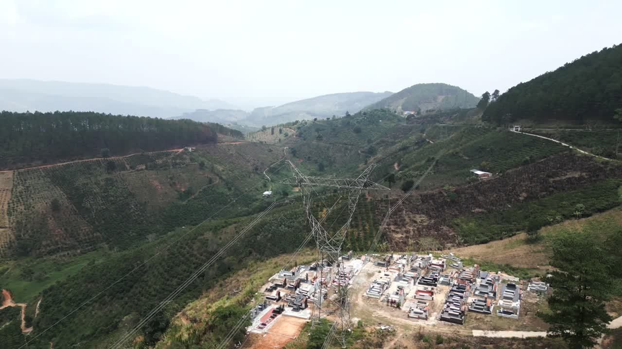 Mountainous Landscape with Cemetery and Power Lines