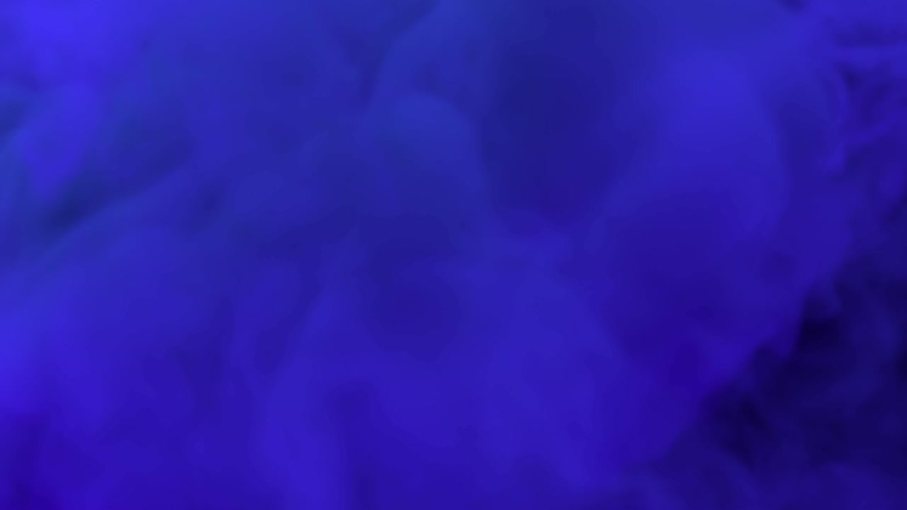 humo de colores expandiéndose hacia la cámara.