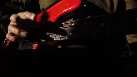 Man-using-thumb-and-finger-slapping-technique-on-the-bass-guitar