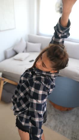 woman dancing in living room