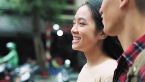 handheld view of vietnamese couple walking