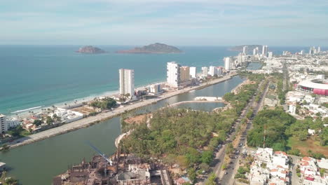 Aerial-of-beautiful-Mexican-city-near-ocean-in-summer