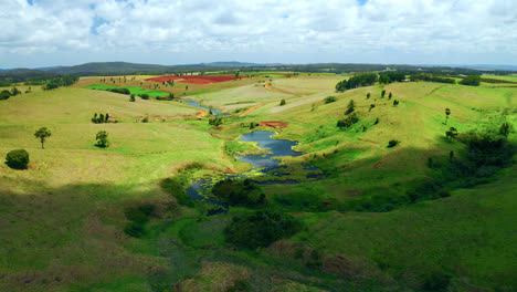 clouds shadow over swamps amidst verdant landscape in atherton tablelands, queensland, australia