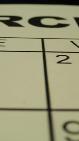 close-up of a calendar and a marker