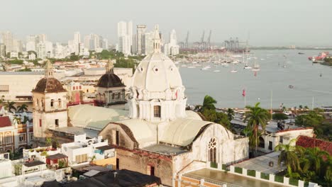 Aerial circle pan shot of the historic Cartagena Cathedral and the surrounding cityscape in cartagena, colombia