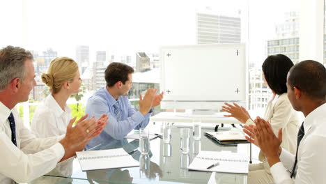 business people applauding at a meeting