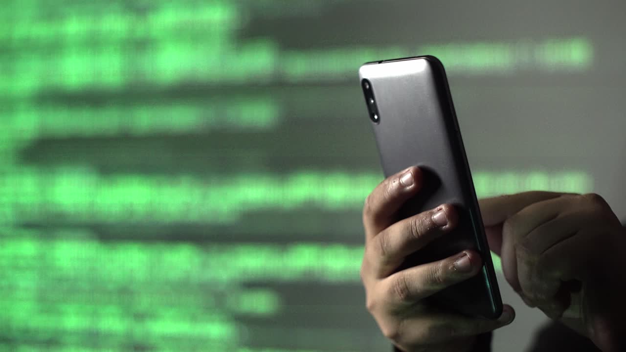 cybersecurity concept. hacker using a phone