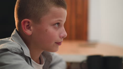 boy listens attentively and smiles nodding with agreement
