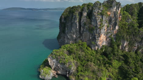 drone flying over the cliffs at railay with ocean views in krabi, thailand