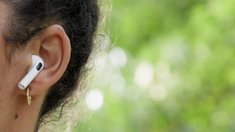 ears, earbuds and woman listening to music