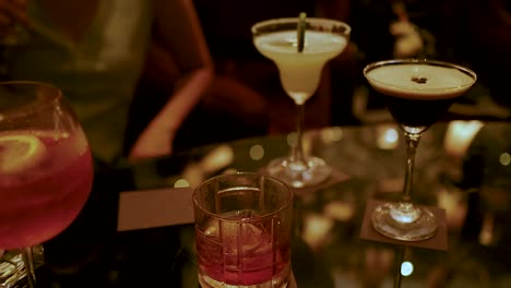 friends enjoying drinks at a stylish bar