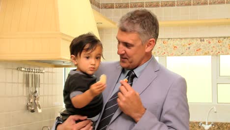 businessman giving food to his son