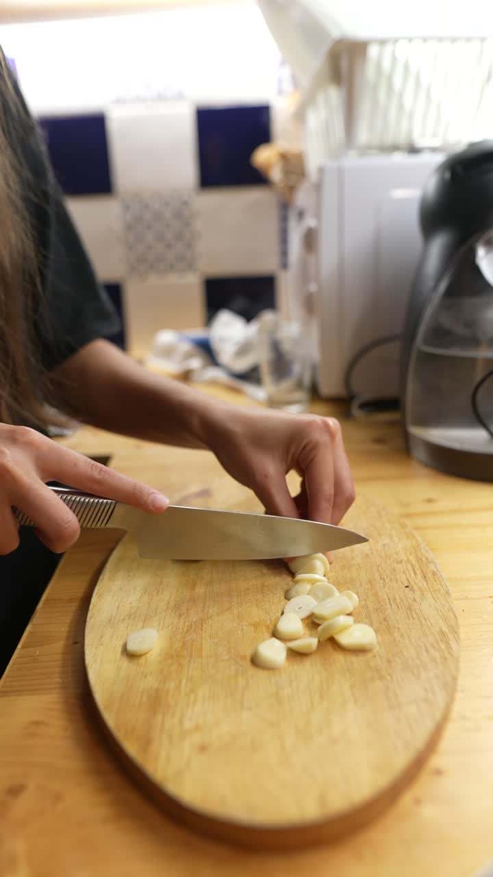 Woman chopping garlic