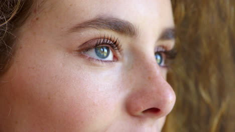 closeup of a woman staring with hope for humanity