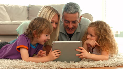 happy family using tablet together