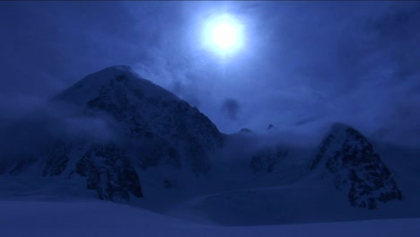 mountain in pale blue light and cloud